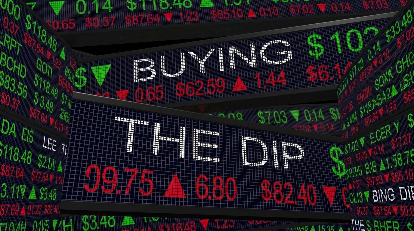 Stock market ticker board reading Buying the Dip